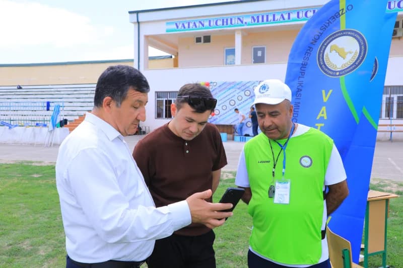 Men reviewing information on smartphone