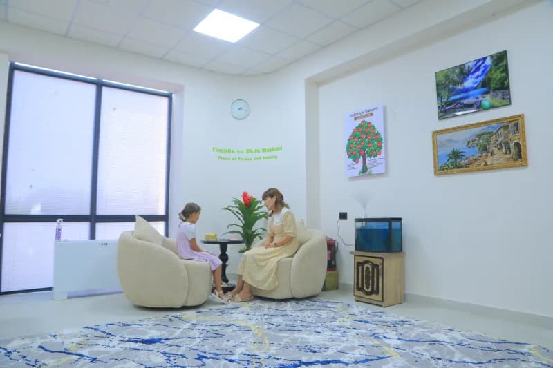 Woman talks with young girl
