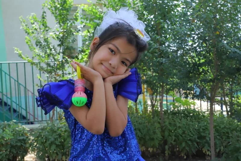 Young girl posing in garden