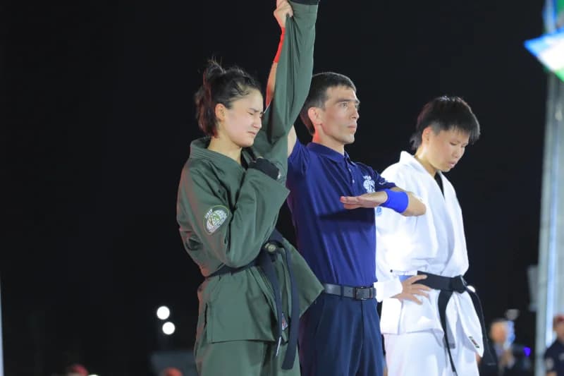 Referee declares winner of match