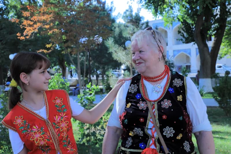 Girl and woman wearing vests