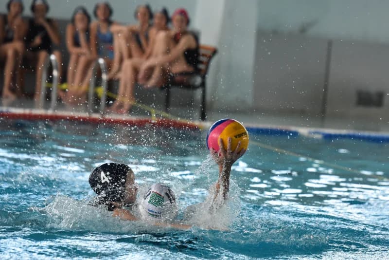 Young athletes playing water polo