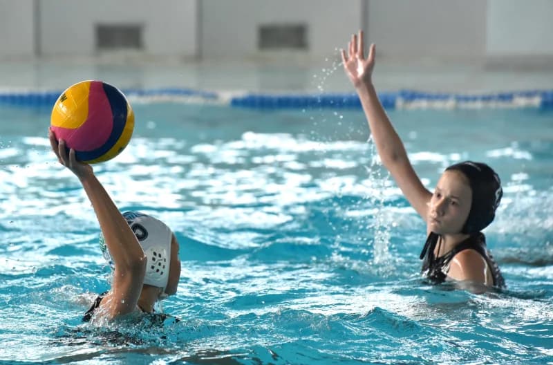 Young athletes playing water polo