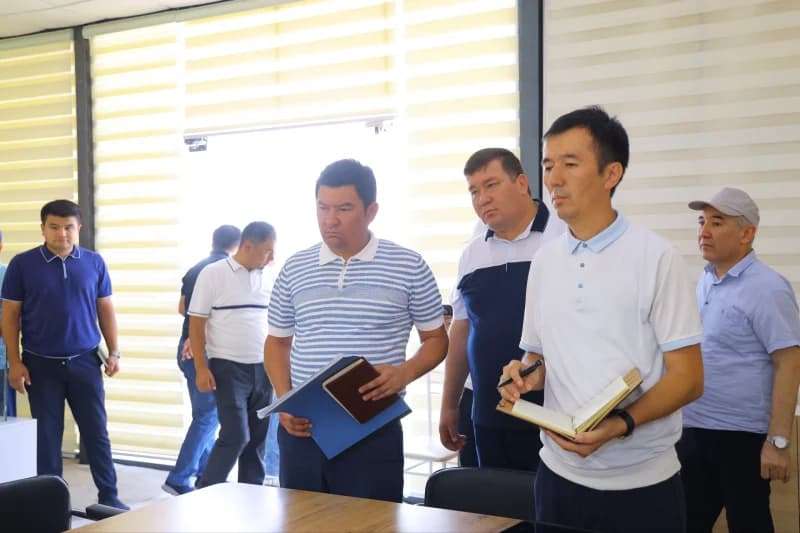 Men attend meeting in office