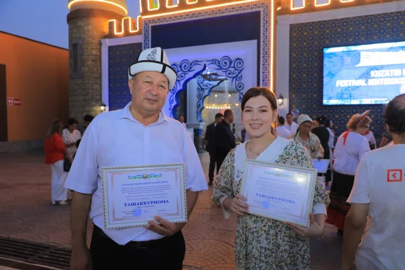 People receive certificates at festival