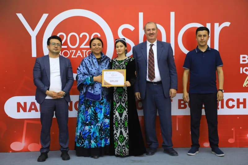 People pose with award certificate