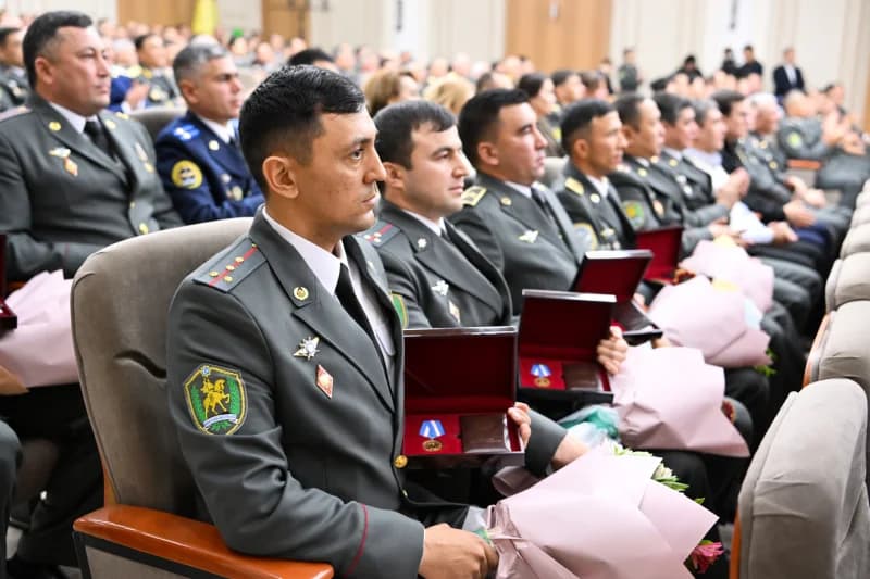 Uniformed servicemen attending award ceremony