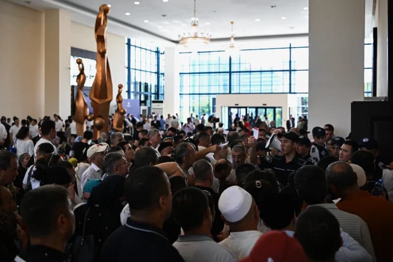 Crowd gathering in large hall