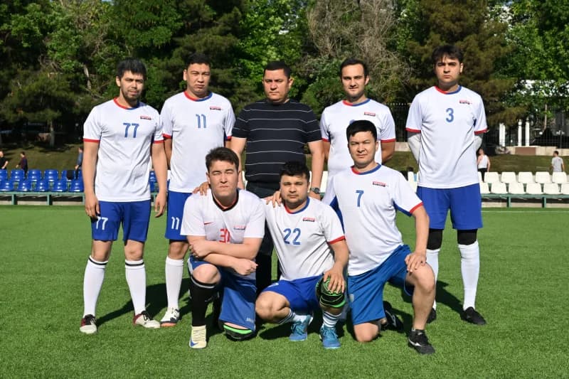 Soccer team posing on field