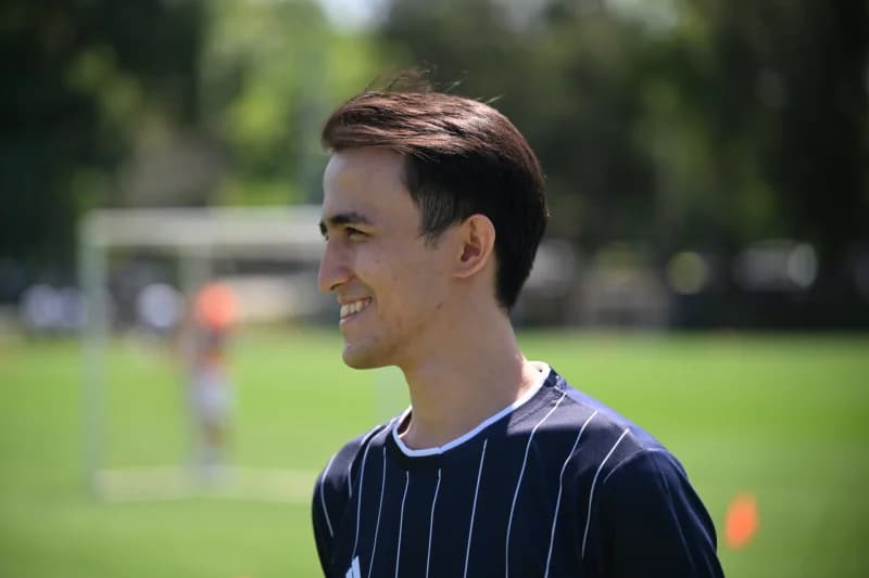Young man smiling during match