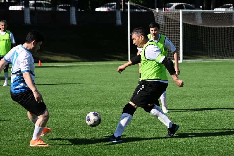 Men playing football on field