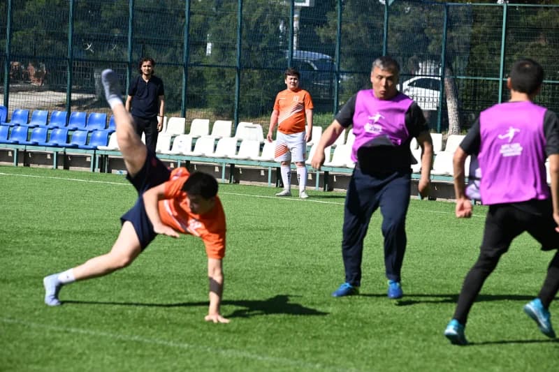 Men playing football on field