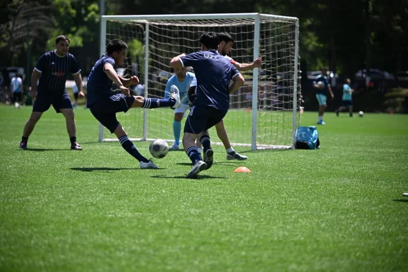 Players competing in football match