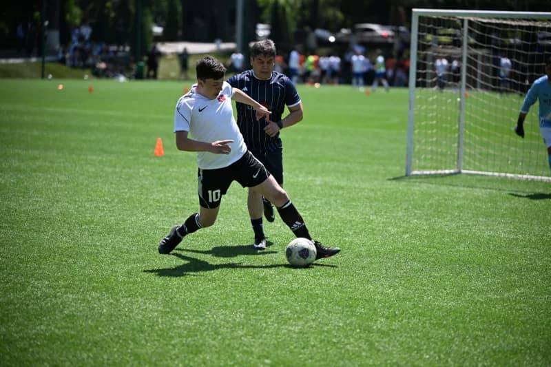 Young athletes playing soccer match