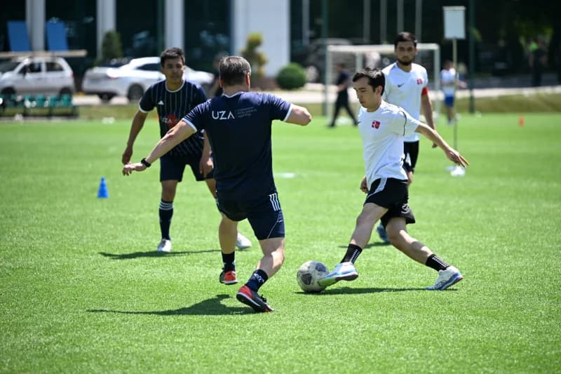 Players competing during football match training