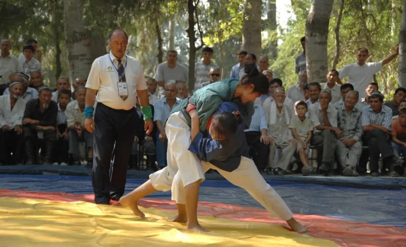 Athletes competing in a match outdoors