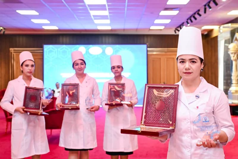 Healthcare professionals holding awards at an event