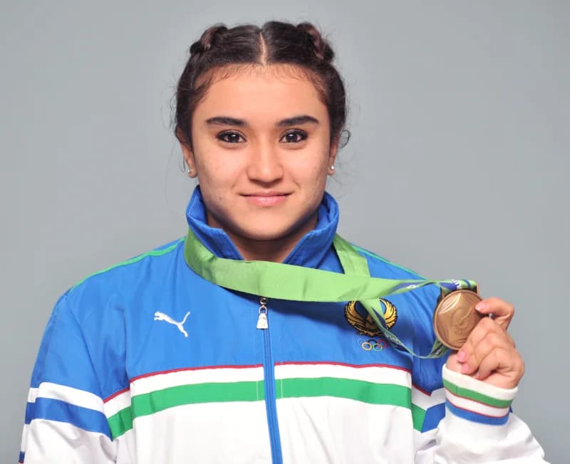 Portrait of an athlete holding a medal