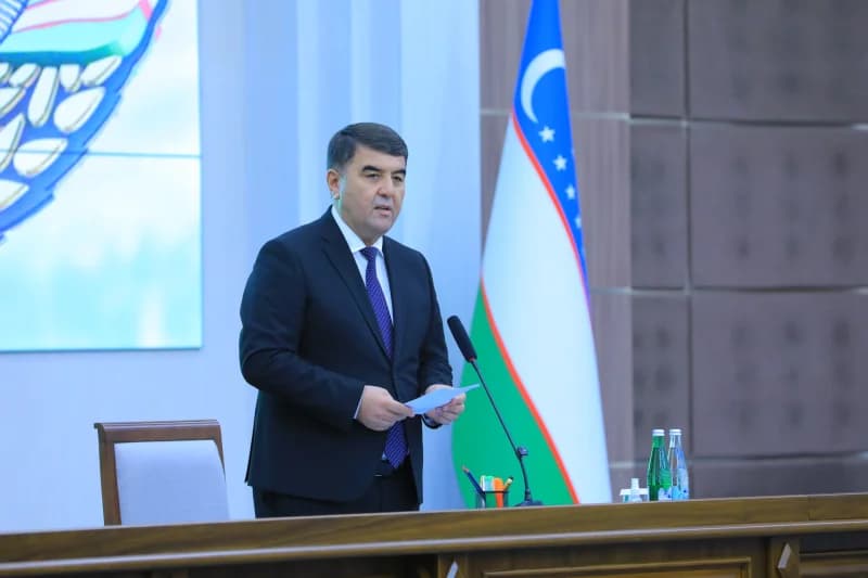 Man speaking at a conference podium