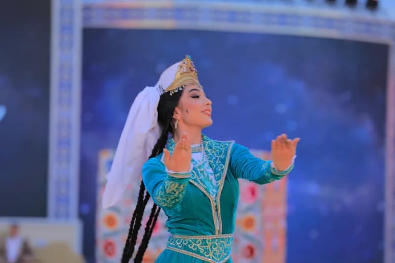 Woman performing traditional dance in decorative attire
