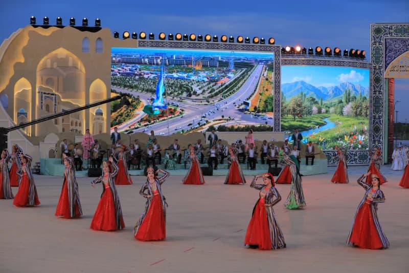 Performers in traditional clothing dancing on stage