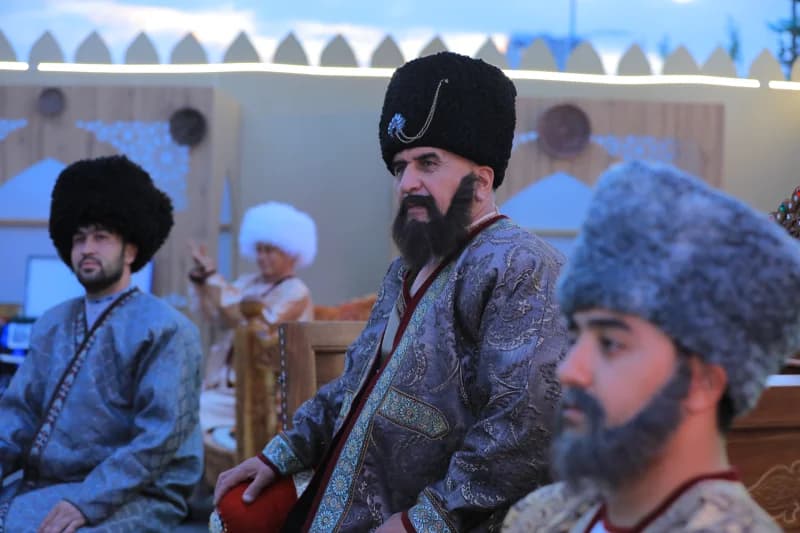 People in traditional clothing and fur hats