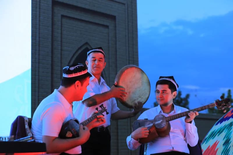 People playing traditional musical instruments outdoors