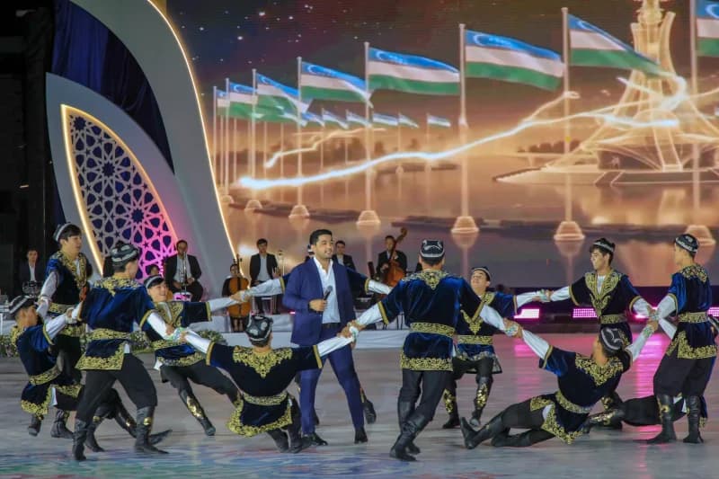 Performers on stage during a cultural event