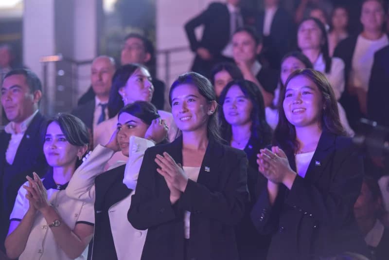 People clapping in an audience