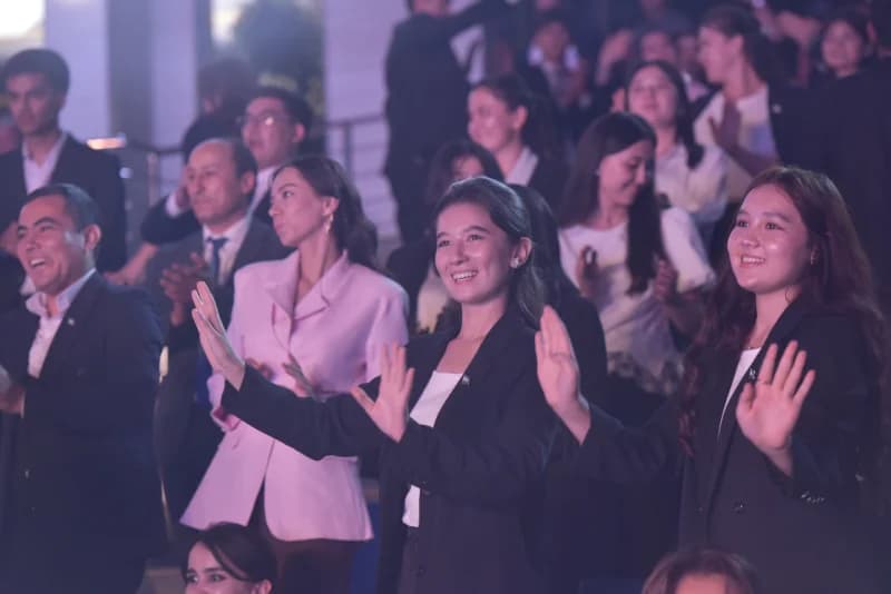 People clapping in an audience