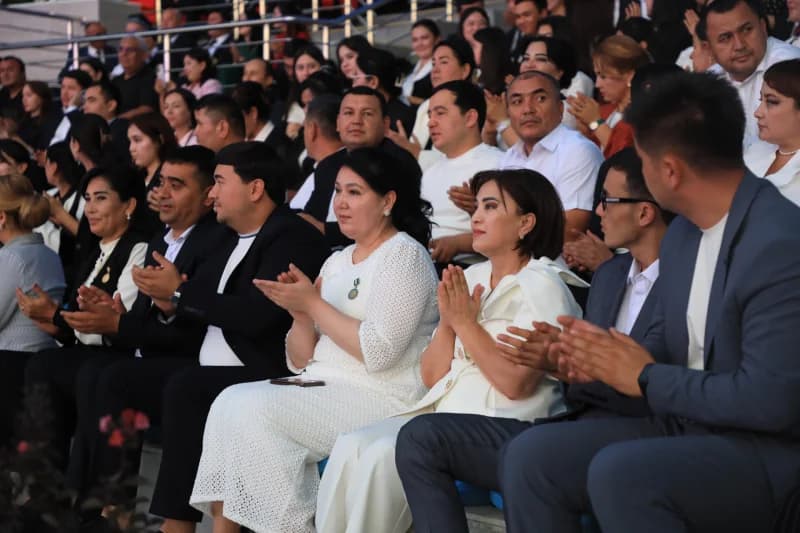 People clapping in an audience