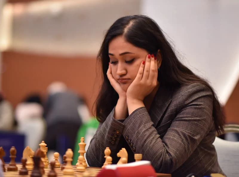 A woman concentrates during a chess match