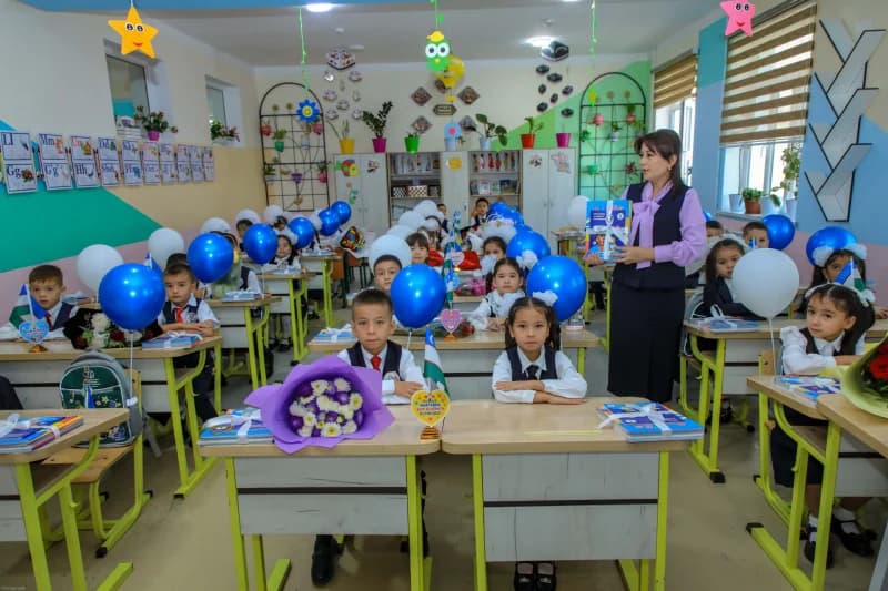 Children sitting at desks in a classroom
