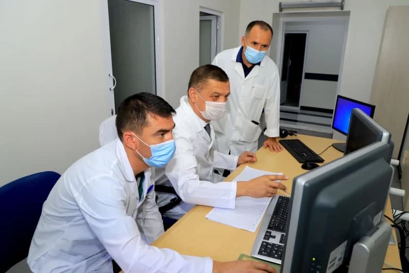 People working in a room with computers
