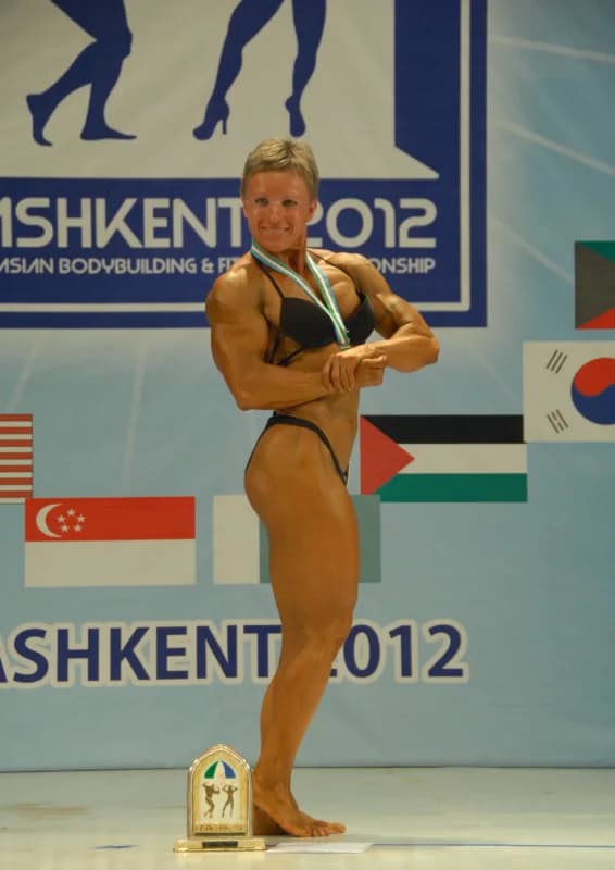 Female bodybuilder posing on stage