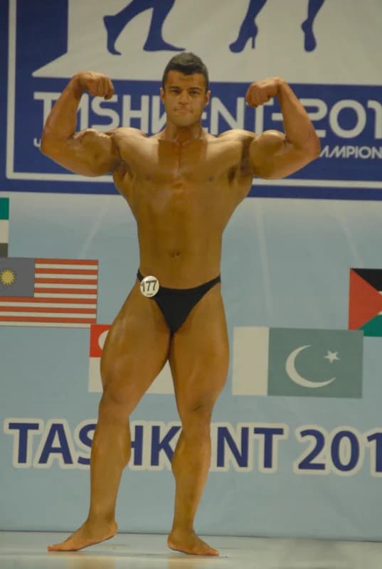 Bodybuilder posing during a sports competition