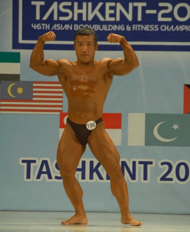 Bodybuilder posing during a sports competition
