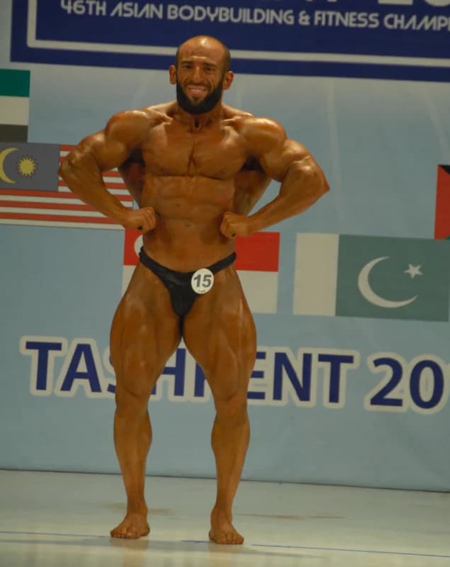 Bodybuilder posing during a sports competition