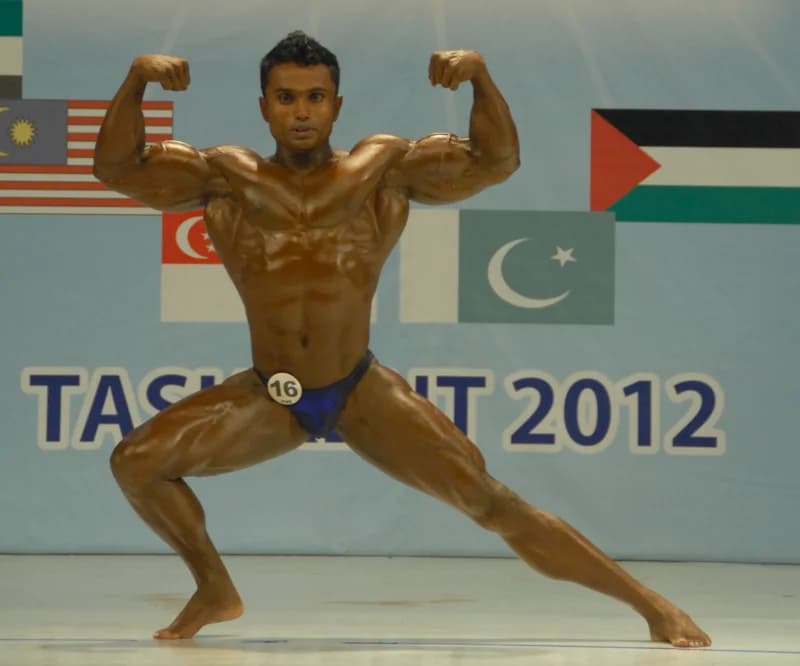 Bodybuilder posing during a sports competition