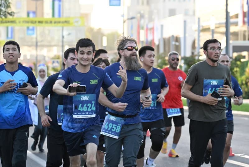 People running outdoors on a city street