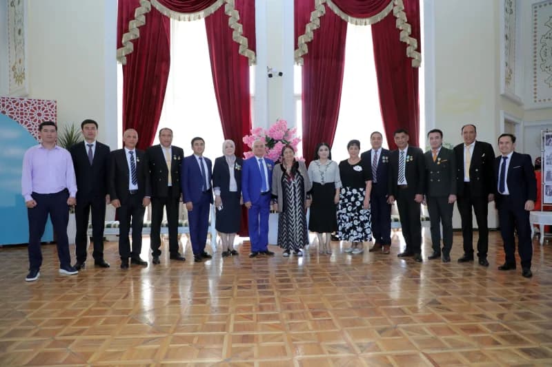 Group portrait of people standing indoors