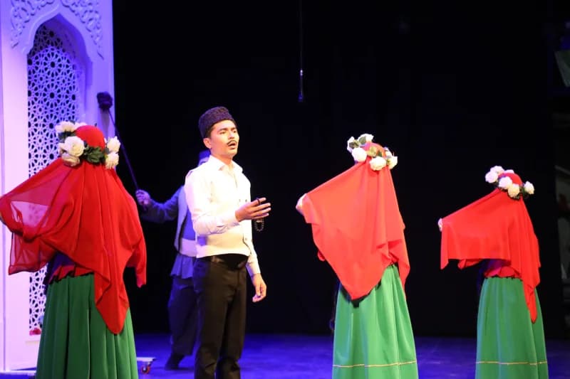 Performers in traditional attire on stage