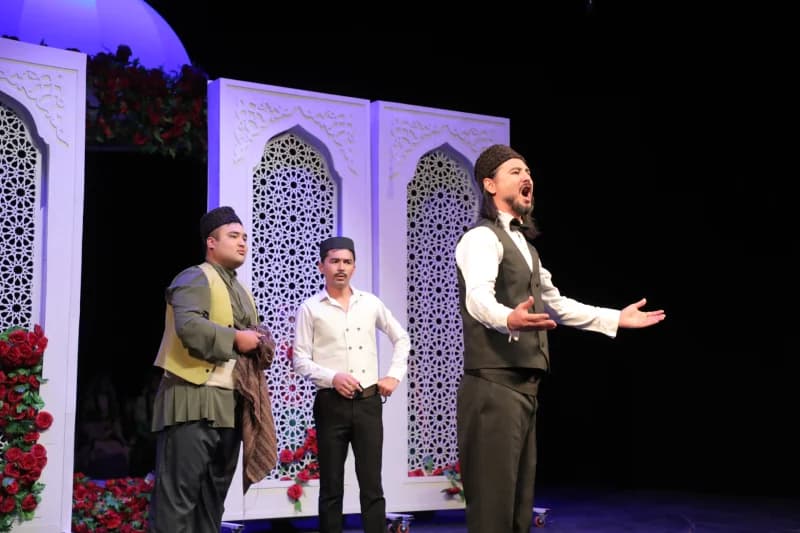 Actors perform on stage during a theatrical presentation
