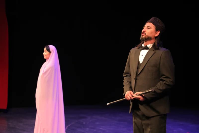 Performers on stage during a theatrical performance