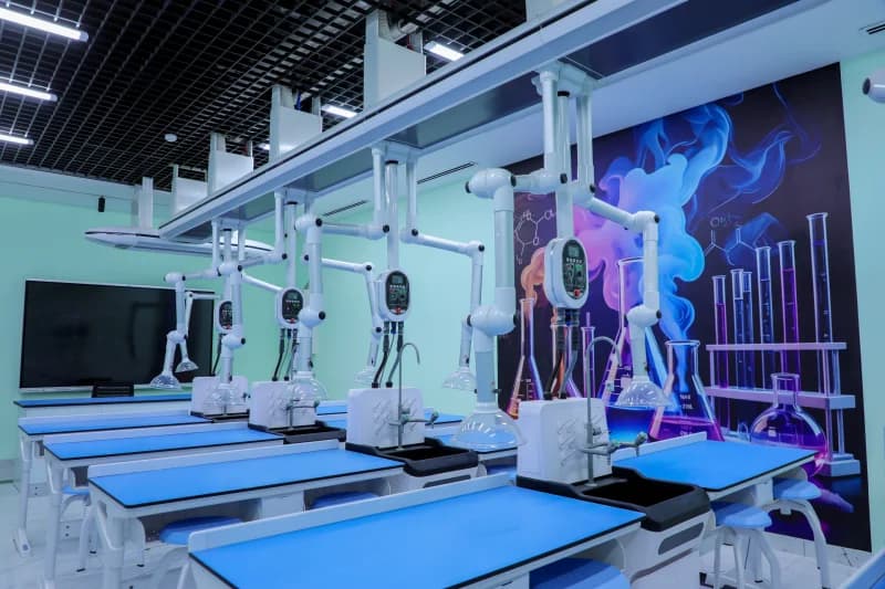 Modern laboratory interior setup with specialized equipment and blue-topped workstations
