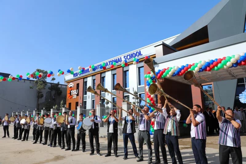 People playing traditional instruments outside a building