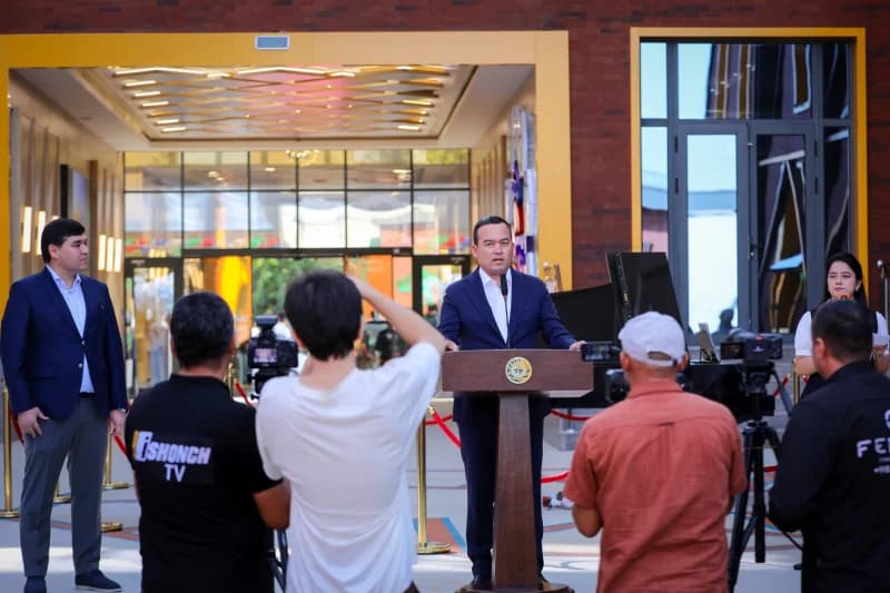 Person speaking at podium during public event