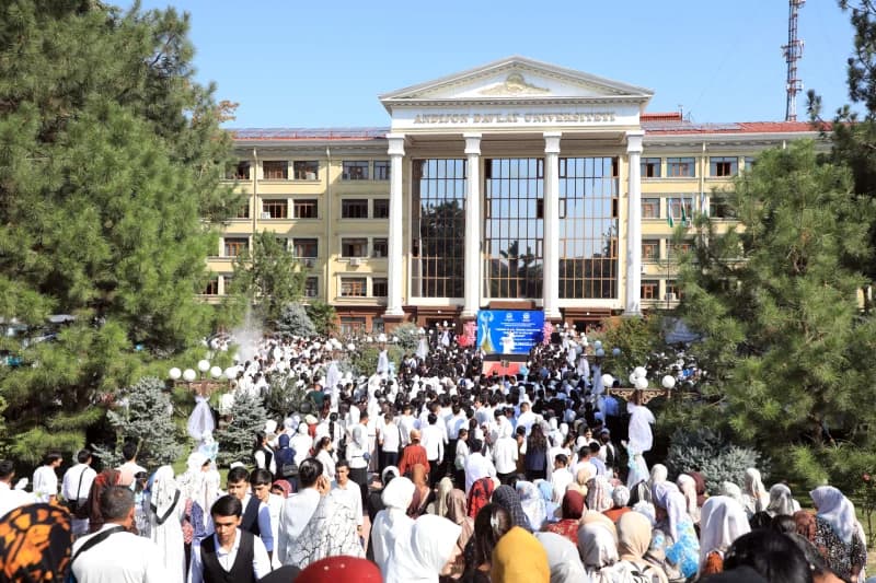 Large gathering of people outside a large building