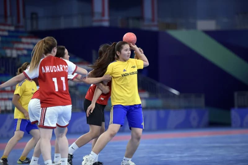 Athletes competing in an indoor sports match