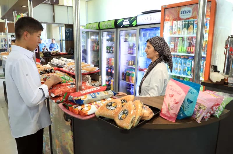 People at a snack counter in a store